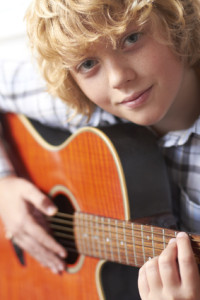 Boy Playing Acoustic Guitar